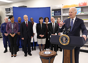U.S. President Joe Biden with Clinical Center leadership and Pharmacy Department staff