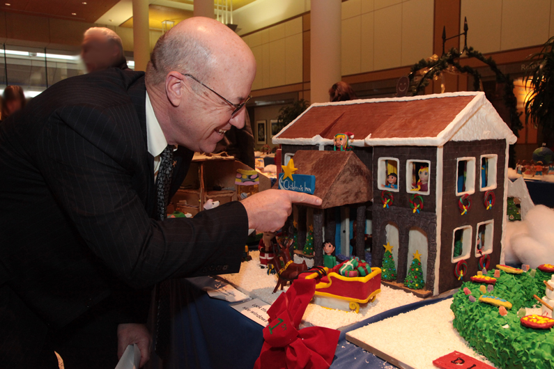 Dr. James Gilman looks at a gingerbread house