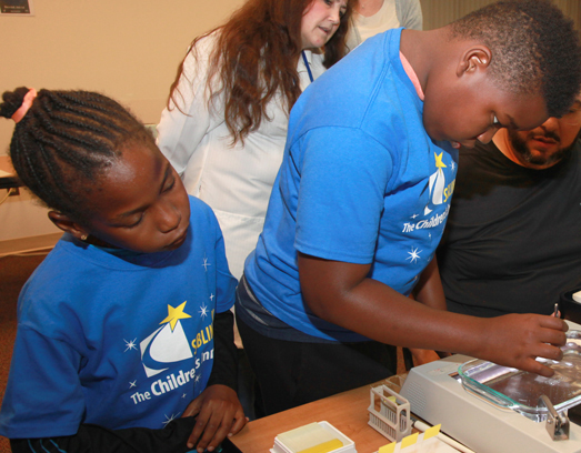 two children complete an activity