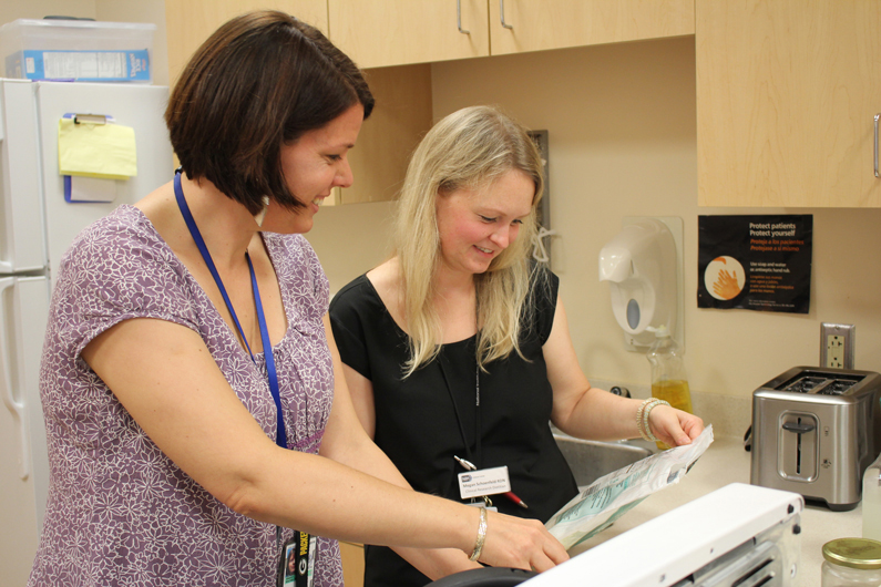 two women working together