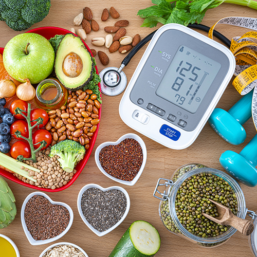 image of many healthy foods and heart monitor
