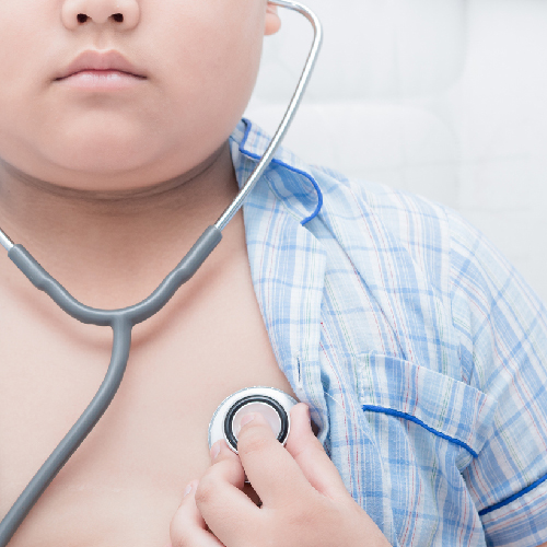 child listening to their heartbeat with a stethoscope
