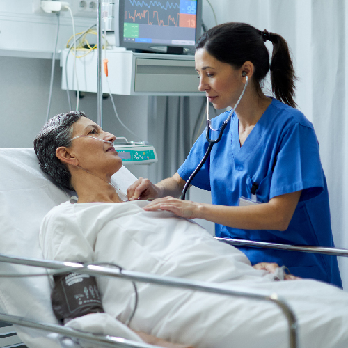 doctor listening to patient's heartbeat