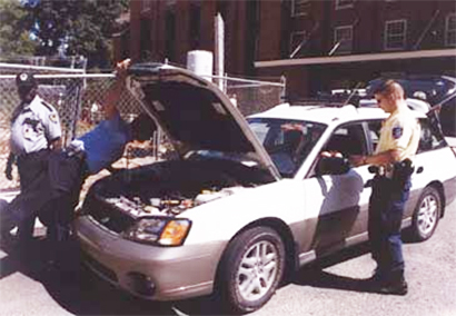 security inspects a vehicle