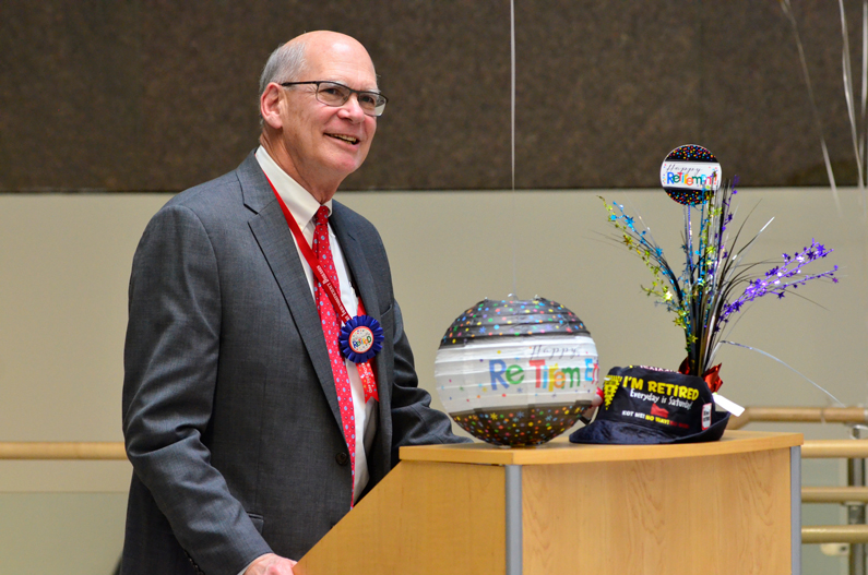 Dr. Thomas Fleisher stands at a podium