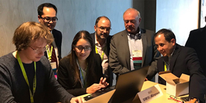 people gathered around computers