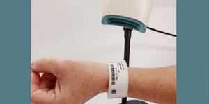 a patient's wristband getting scanned upon checking in or out