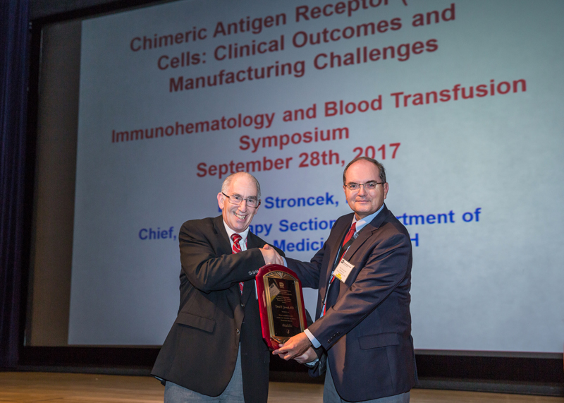 Dr. Harvey G. Klein presenting the Richard J. Davey Award to Dr. David F. Stroncek