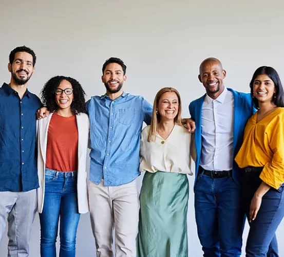 a group of people standing together smiling