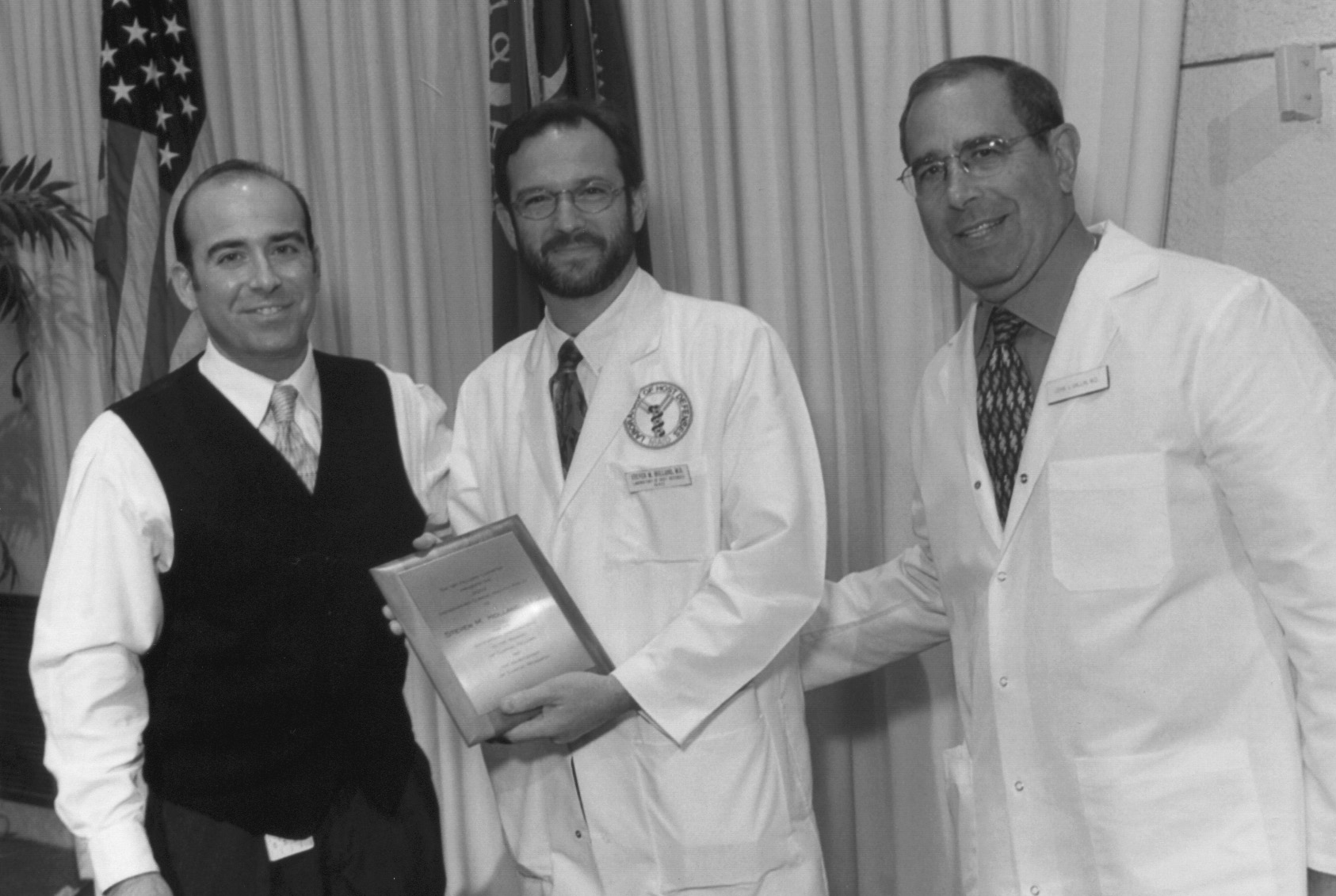 Photo of Dr. Holland receiving his award