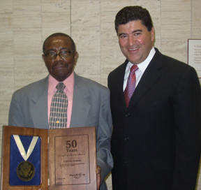 Clifford Thomas (left) is joined by Dr. Elias Zerhouni at the HHS Secretary's Departmental Honor Awards.