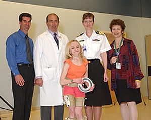 (Back row, from left to right) Dr. Steven Stanhope, Dr. John Gallin, Karen Siegel and Dr. Lynn Gerber celebrate the opening of the new lab with patient Brianne Schwantes (front row)