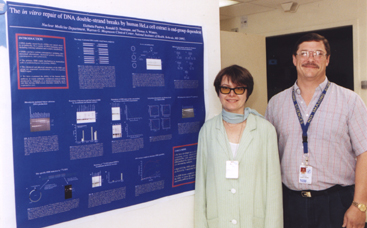 photo of Dr. Pastwa and Dr. Winters standing beside the award winning poster