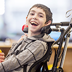 photo of child with disability smiling