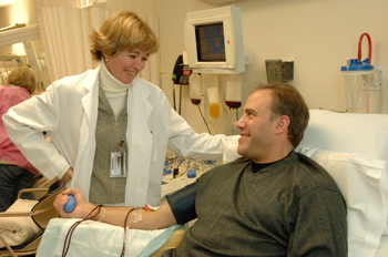 Dr. Cathy Cantilena talks with a blood donor. 