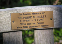 The inscription on the bench's plaque