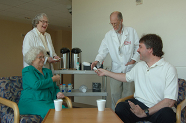 Harry and Floride Canter share coffee, cookies, and conversation with patients.