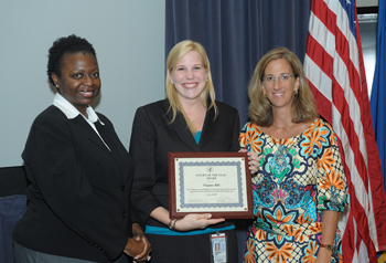 Ginny Hill receives Intern of the Year award from CC COO and PMF leader