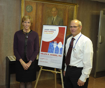 Drs. Hobbs and Gahl stand with a poster promoting her lecture