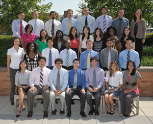 The 2010-2011 class of Clinical Research Training Program fellows pose in three rows outside the Clinical Center.