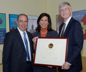 Dr. Huda Y. Zoghbi with Clinical Center Director Dr. John I. Gallin (left) and NIH Director Dr. Francis S. Collins