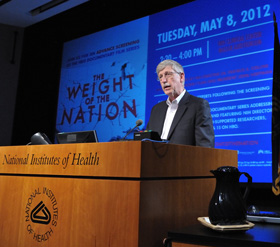 NIH Director Dr. Francis S. Collins speaking at a podium