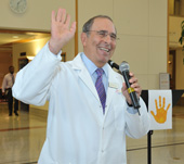 Clinical Center Director Dr. John I. Gallin waving