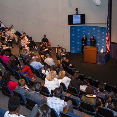 Doctors at NIH speak in a lecture hall during Nurses Week