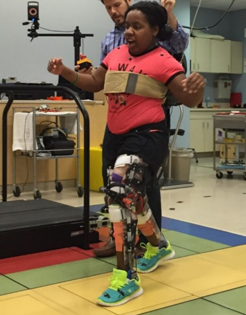 Child wearing a pediatric exoskeleton