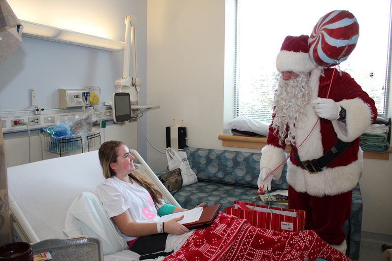 For the children who were unable to leave their room, Santa came to them with gifts in hand