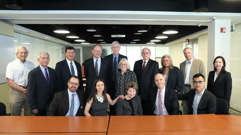 A large group of NIH leaders gather with Former NIAMS Director Stephen I. Katz’s family