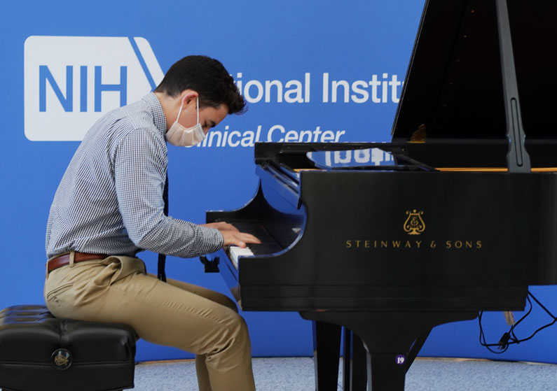 Robert Masi performs in the Clinical Center