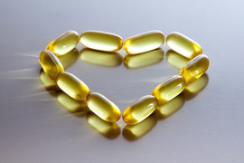 fish oil pills aligned in a shape of a heart