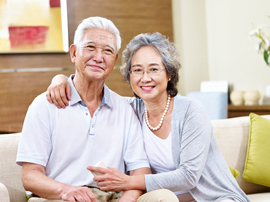 an older man and woman smiling