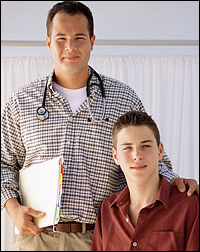 Male doctor with teenage boy.